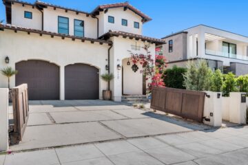 Two unique homes with very different styles. The prominent one uses an Hacienda style while the other is more modern.